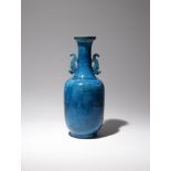 A CHINESE TURQUOISE GLAZED 'LANDSCAPE' VASE QING DYNASTY The body and tall neck incised with