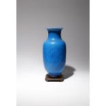 A CHINESE TURQUOISE GLAZED VASE 19TH CENTURY The ovoid body surmounted by a short waisted neck,