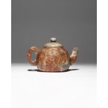 A CHINESE SOAPSTONE TEAPOT AND COVER QING DYNASTY Decorated in low relief with two cartouches