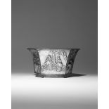 A CHINESE SILVER JARDINIERE 19TH CENTURY The flaring body with six facets, decorated in relief