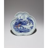 A CHINESE UNDERGLAZE BLUE AND RED 'THREE FRIENDS OF WINTER' DISH 18TH CENTURY Shaped as a cloud,