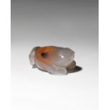 A CHINESE AGATE 'THREE-LEGGED TOAD' PENDANT QING DYNASTY The amphibian carved with its eyes wide