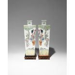 A PAIR OF CHINESE FAMILLE ROSE SQUARE-SECTION VASES 19TH CENTURY Painted with figures and animals in