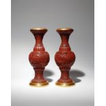 A PAIR OF CHINESE CINNABAR LACQUER 'SCHOLARS' VASES 18TH/EARLY 19TH CENTURY Each carved to the