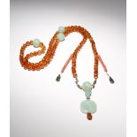 A CHINESE AMBER AND JADEITE CEREMONIAL COURT NECKLACE 19TH CENTURY The ninety-eight amber beads