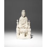 A CHINESE BLANC DE CHINE FIGURE OF GUANYIN 17TH/EARLY 18TH CENTURY The goddess sits in dhyanasana on