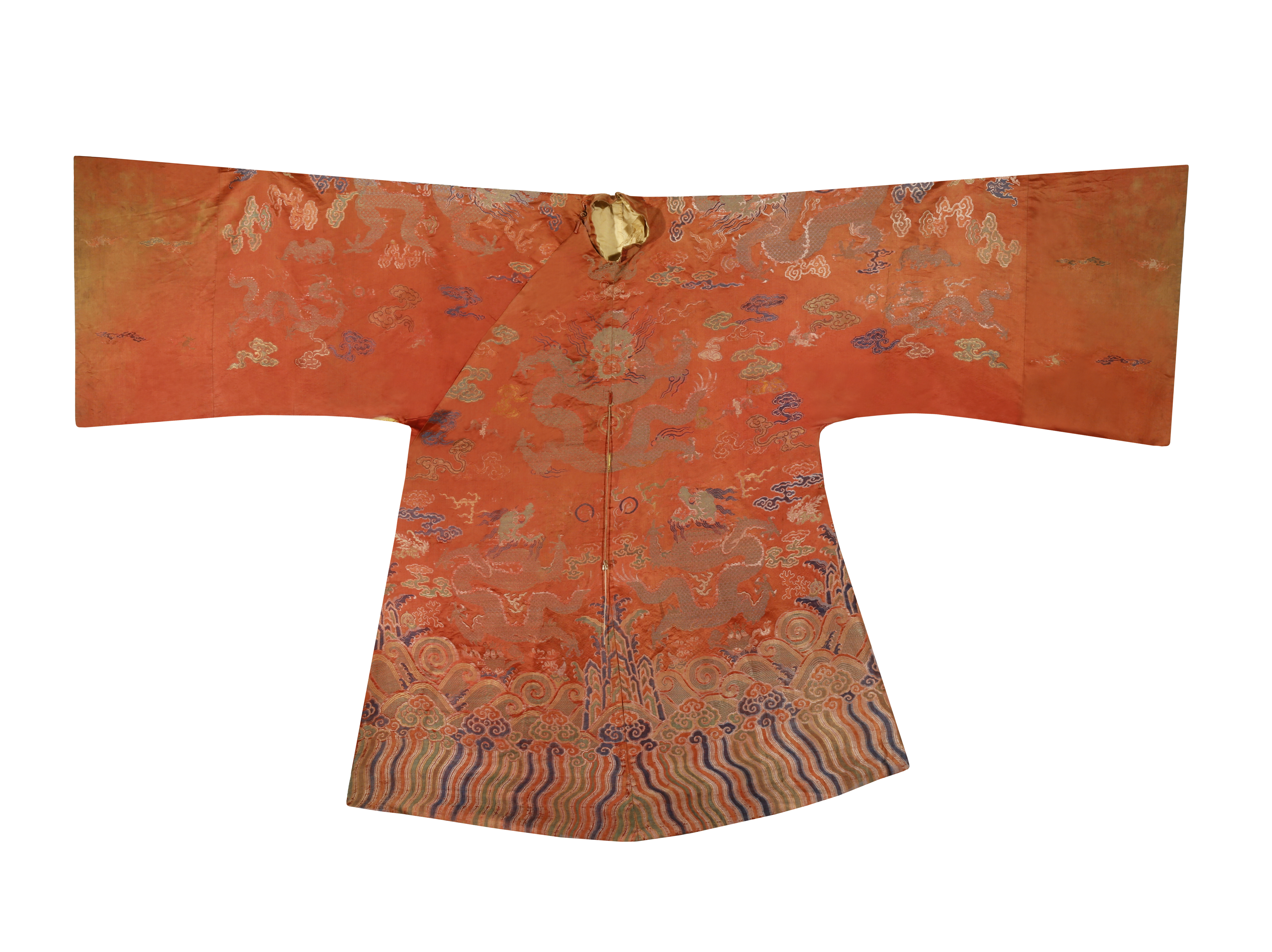 A CHINESE ORANGE-GROUND EMBROIDERED SILK 'DRAGON' ROBE LATE QING DYNASTY Decorated with the mythical