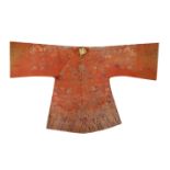 A CHINESE ORANGE-GROUND EMBROIDERED SILK 'DRAGON' ROBE LATE QING DYNASTY Decorated with the mythical