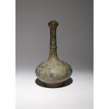 A CHINESE BRONZE GARLIC-MOUTH BOTTLE VASE HAN DYNASTY The compressed body surmounted by a tall