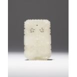 A CHINESE WHITE JADE PENDANT 18TH/19TH CENTURY The rectangular body carved to one side with twin-