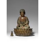 A CHINESE PARCEL-GILT AND LACQUERED-BRONZE FIGURE OF BUDDHA MING DYNASTY Depicted seated in