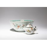 A LARGE CHINESE FAMILLE ROSE BOWL AND A TEAPOT AND COVER QING DYNASTY The bowl painted to the