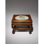 A CHINESE PORCELAIN INSET WOOD STAND LATE QING DYNASTY The top set with a quatrefoil porcelain panel