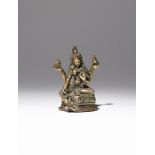 A SMALL NEPALESE BRONZE FIGURE OF A FOUR-ARMED TARA PROBABLY 16TH CENTURY Cast seated in lalitasana,