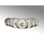EIGHT CHINESE FAMILLE ROSE DISHES 18TH CENTURY Comprising: a set of four plates painted with