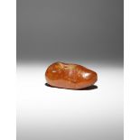 A LARGE PIECE OF AMBER PREHISTORIC Naturalistically formed, the fossilized tree resin of a warm dark