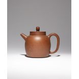 A LARGE CHINESE YIXING TEAPOT AND COVER LATE 18TH/EARLY 19TH CENTURY The plain body set with an
