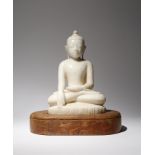 A BURMESE MANDALAY STYLE MARBLE FIGURE OF BUDDHA SHAKYAMUNI 18TH/19TH CENTURY Depicted seated in