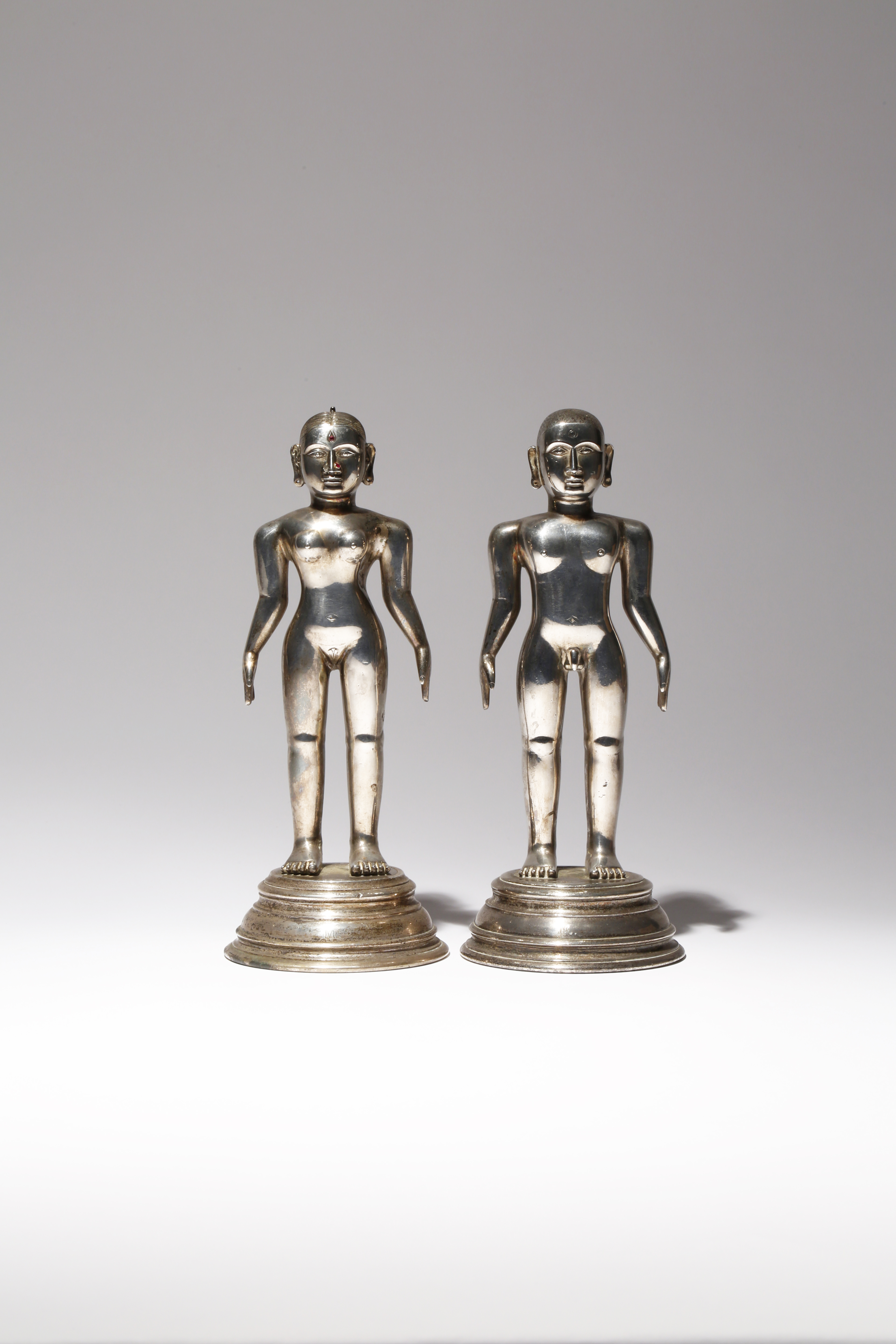 A PAIR OF JAIN SILVER STANDING FIGURES 18TH/19TH CENTURY Each modelled naked in the standing posture