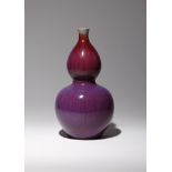 A CHINESE FLAMBE GLAZED GOURD-SHAPED VASE, HULUPING QING DYNASTY The exterior brightly decorated