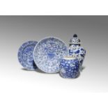 FOUR CHINESE BLUE AND WHITE ITEMS KANGXI 1662-1722 Comprising: an ovoid jar decorated with flowering