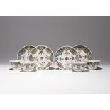 A SET OF FOUR CHINESE FAMILLE ROSE TEA BOWLS AND SAUCERS QIANLONG 1736-95 Each brightly painted in