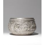 AN INDIAN SILVER BOWL 19TH CENTURY Decorated in repoussé with a continuous scene depicting figures