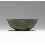 A CHINESE SPINACH-GREEN JADE BOWL 18TH/19TH CENTURY The plain body carved with a gently flaring rim,