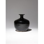 A CHINESE BLACK GLAZED VASE PROBABLY SONG DYNASTY The stout body tapering gently towards the foot,