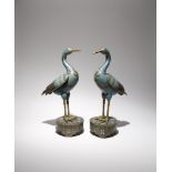 A PAIR OF CHINESE CLOISONNE MODELS OF CRANES C.1900 Each bird stands tall upon a lotus-decorated