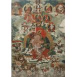 A TIBETAN THANGKA 19TH CENTURY Painted to the centre with Vaishravana seated upon a recumbent snow