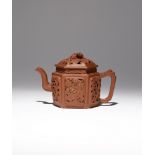 A CHINESE YIXING HEXAGONAL-SECTION TEAPOT AND COVER EARLY 18TH CENTURY Pierced to each facet with