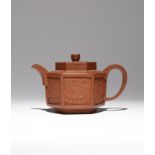 A CHINESE YIXING HEXAGONAL-SECTION 'DRAGON AND PHOENIX' TEAPOT AND COVER EARLY 18TH CENTURY The body