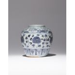 A CHINESE BLUE AND WHITE JAR MING DYNASTY The ovoid body decorated with a continuous scroll of