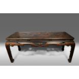 A CHINESE LACQUER TABLE 19TH CENTURY The rectangular top decorated in gold and red lacquer with a