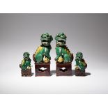 TWO PAIRS OF CHINESE SANCAI MODELS OF LION DOGS 19TH CENTURY Each beast depicted seated upon a