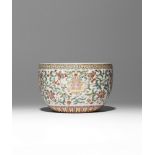 A CHINESE FAMILLE ROSE 'LOTUS' BOWL 20TH CENTURY Painted with four large lotus flowerheads set