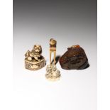 λ THREE JAPANESE IVORY NETSUKE EDO PERIOD AND LATER, 18TH CENTURY AND LATER One carved as a small