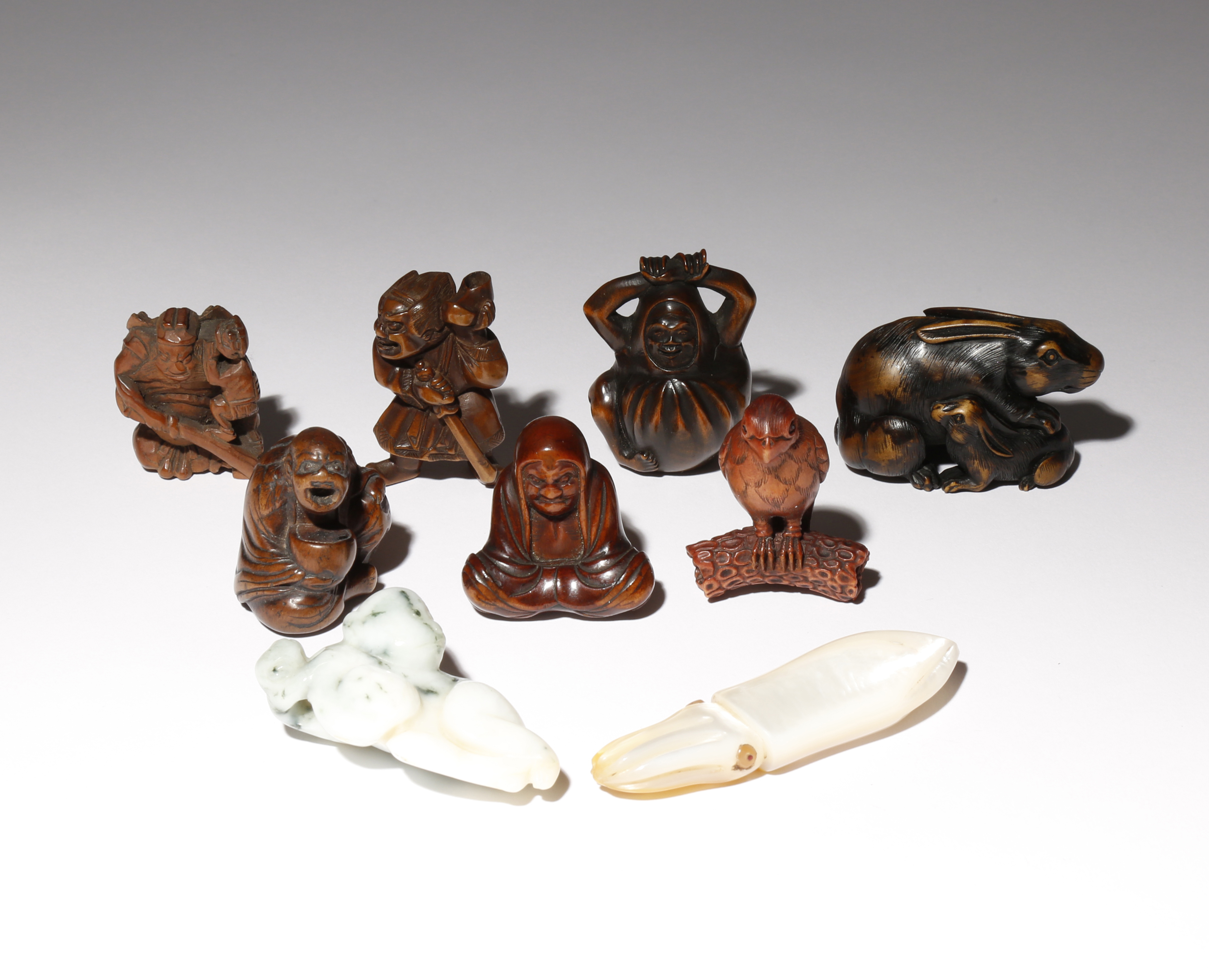 A COLLECTION OF EIGHT JAPANESE NETSUKE EDO PERIOD AND LATER, 18TH CENTURY AND LATER Seven made of