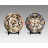 TWO MASSIVE JAPANESE IMARI CHARGERS EDO PERIOD, 18TH CENTURY Both decorated in underglaze blue,