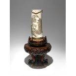 λ A LARGE JAPANESE IVORY TUSK VASE MEIJI PERIOD, 19TH CENTURY Carved in low relief with two