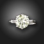 A diamond solitaire ring, the old circular-cut diamond weighs 2.08cts, with baguette-shaped shoulder