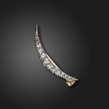 A Victorian diamond-set open crescent brooch, the graduated old cushion-shaped diamonds are set in