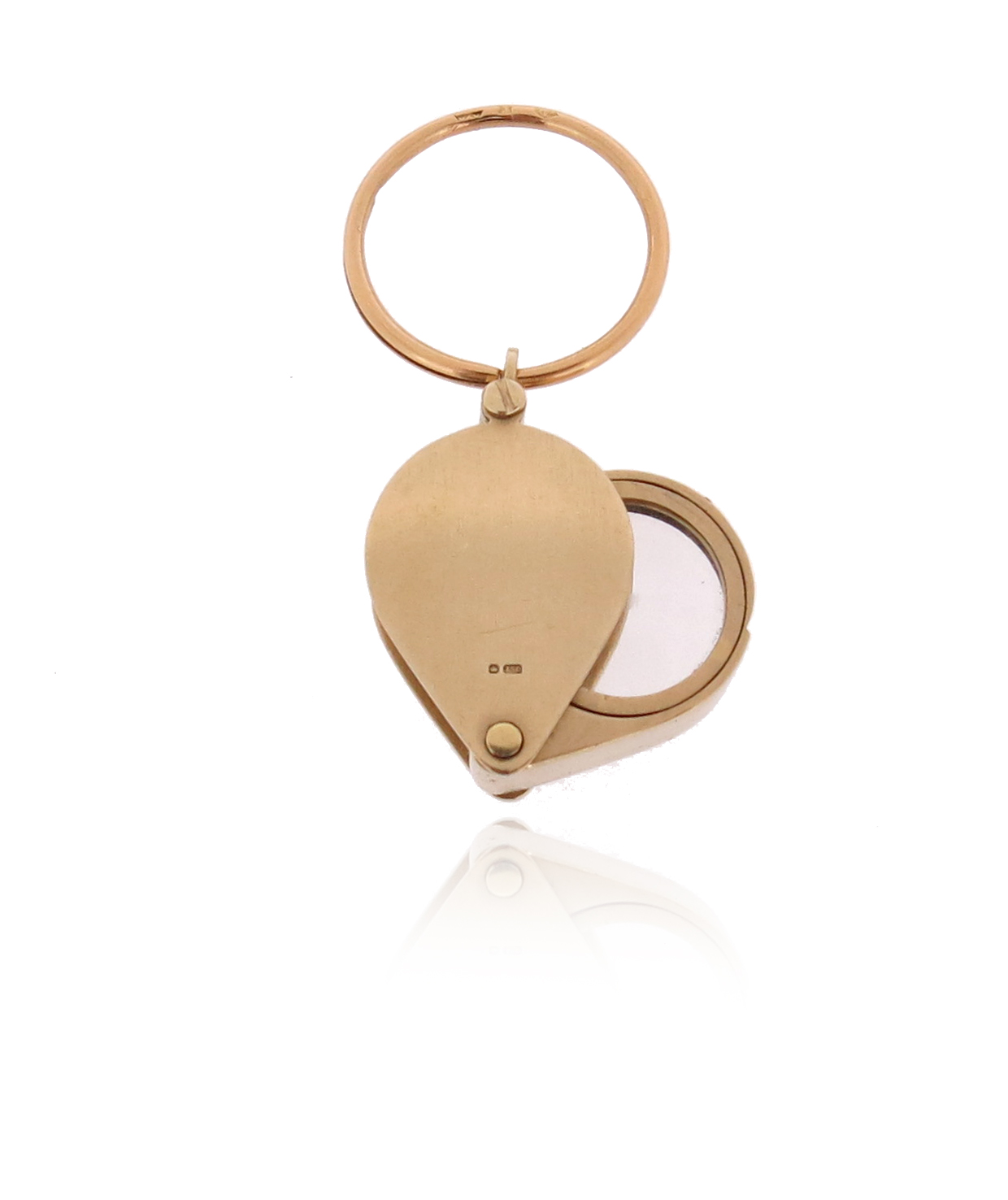 An 18ct gold jewellery loupe, London marks for 1987, with a gold suspension loop, loupe 2.7cm