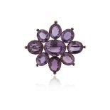 A Victorian amethyst brooch pendant, of flowerhead form, set with oval-shaped amethysts in silver