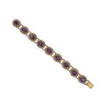 A Victorian amethyst and seed pearl bracelet, the nine amethyst and pearl clusters set in open and