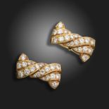 A pair of French diamond-set yellow gold stylised bow cufflinks, set with graduated round