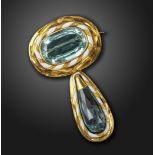 A Victorian aquamarine and enamel brooch, the oval shaped aquamarine is set within twisted white