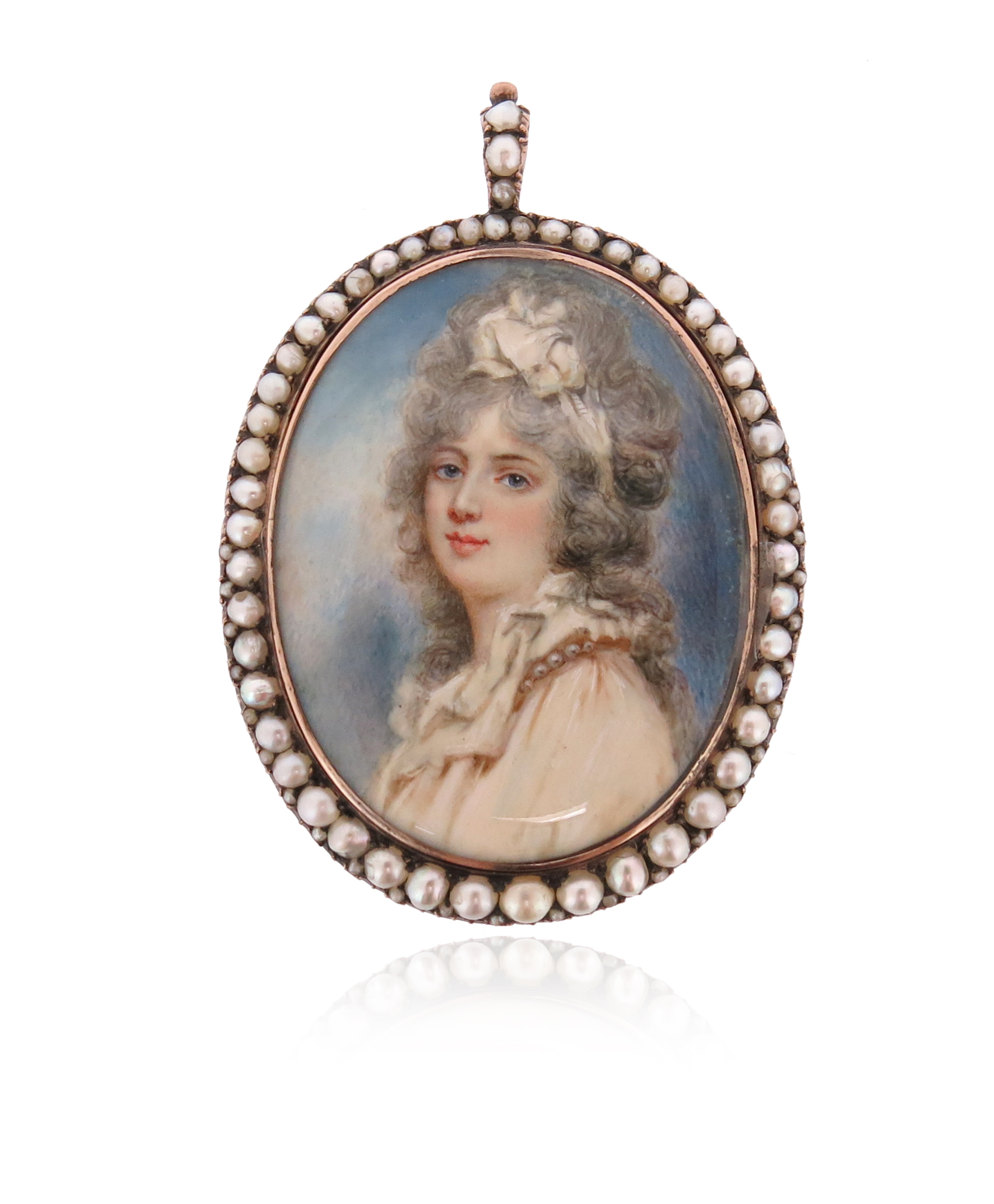 An early 19th century portrait miniature locket pendant, the miniature depicting a portrait of a