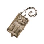 An early 20th century cat-form silver gilt minaudiθre, the rectangular box realistically chased with